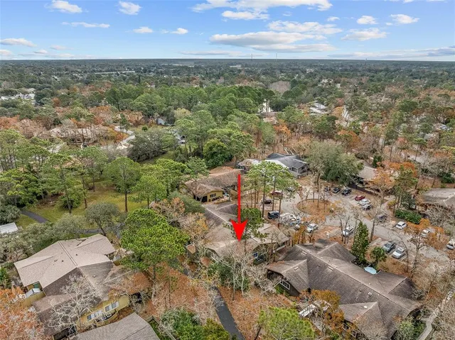 an aerial view of residential houses with outdoor space