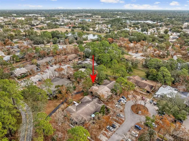an aerial view of residential houses with outdoor space