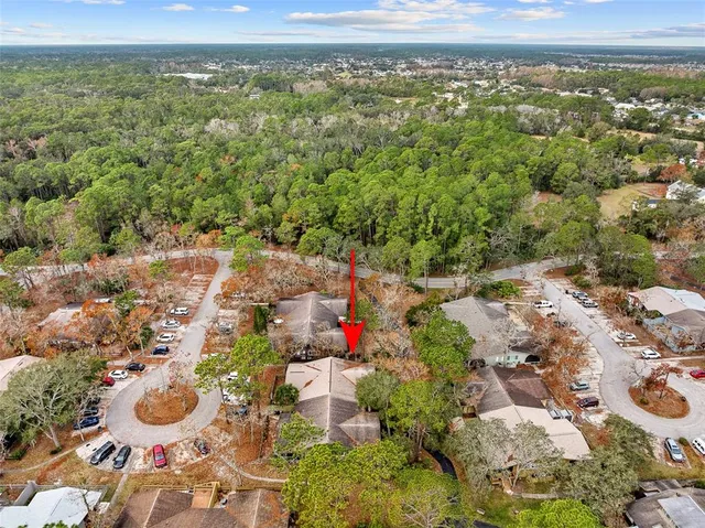 an aerial view of residential houses with outdoor space