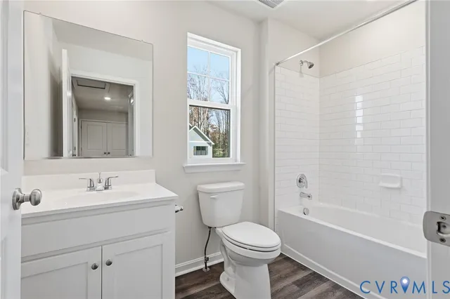 a bathroom with a sink toilet and a mirror