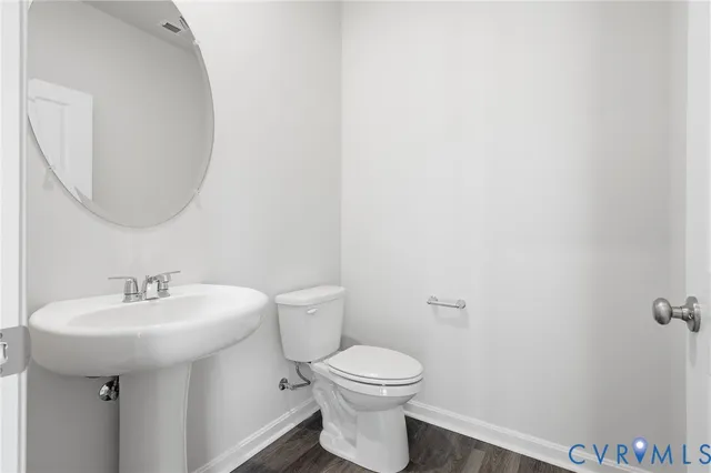a bathroom with a toilet sink and shower