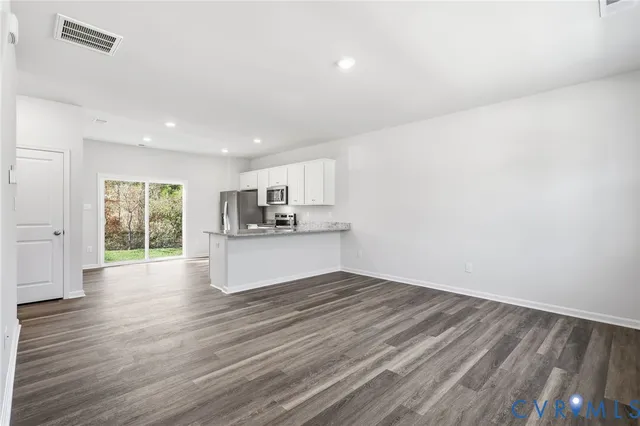 a view of kitchen and wooden floor