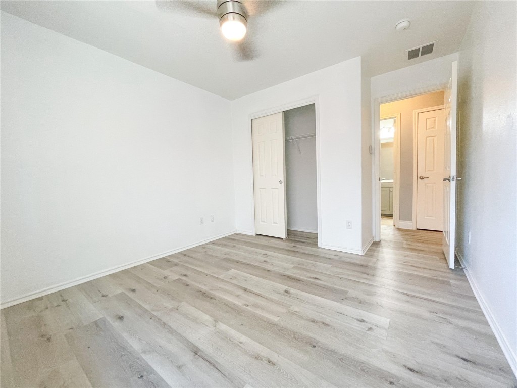 2401 Christoff Loop Austin, TX 78748 - Photo 13 of 36 a view of an empty room with wooden floor
