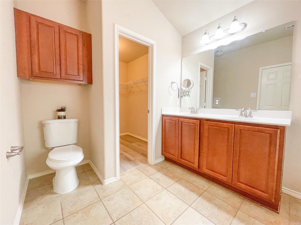 2401 Christoff Loop Austin, TX 78748 - Photo 27 of 36 a bathroom with a toilet sink and mirror