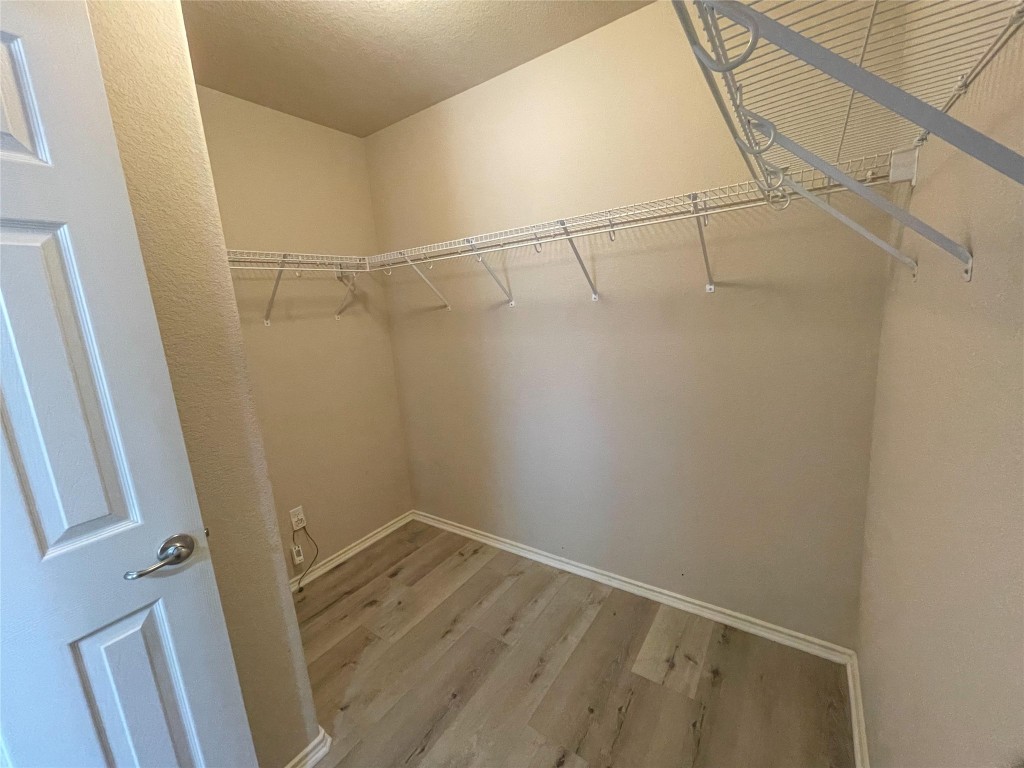 2401 Christoff Loop Austin, TX 78748 - Photo 28 of 36 a view of a room with racks on the wall