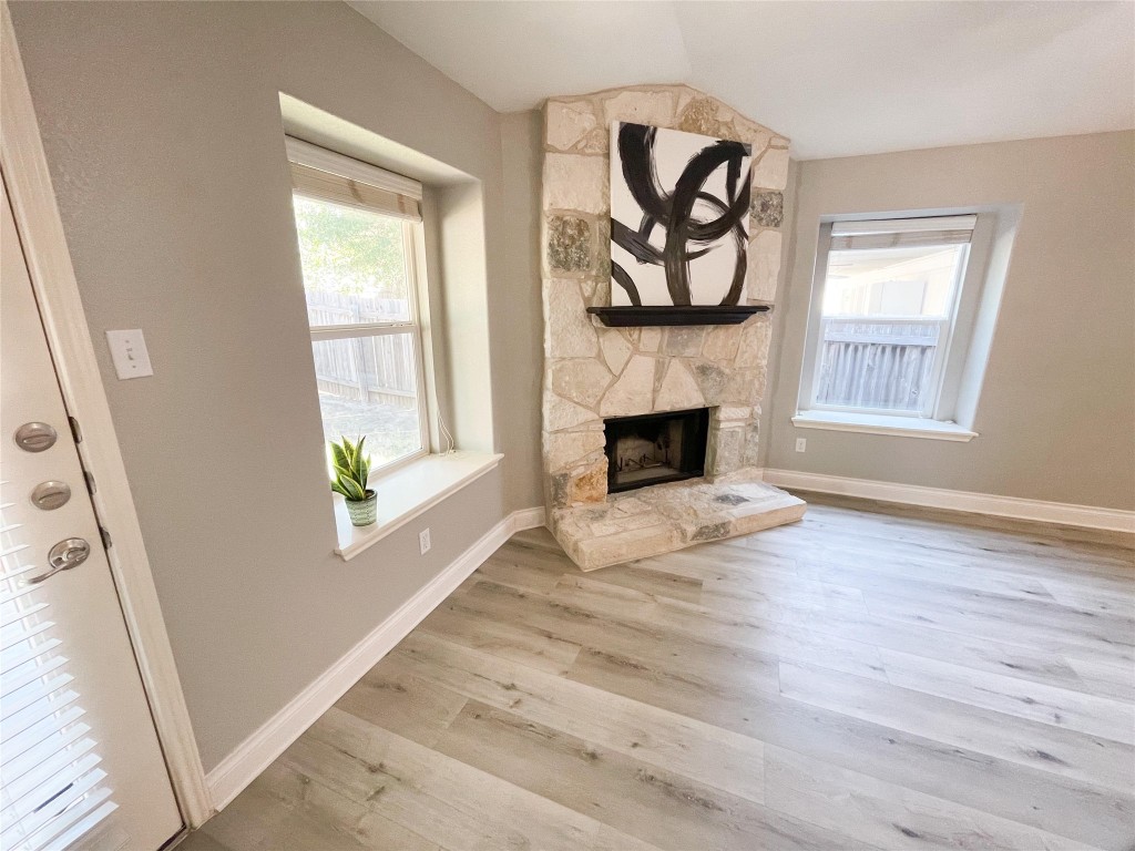 2401 Christoff Loop Austin, TX 78748 - Photo 8 of 36 a view of an empty room with window and wooden floor