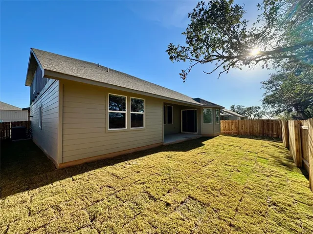a house with trees in the background