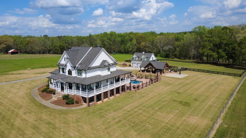 3386 Chandler Road Good Hope, GA 30641 - Photo 2 of 96 a view of a house with swimming pool and sitting area