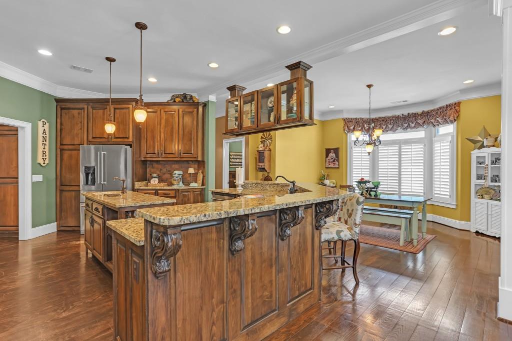 3386 Chandler Road Good Hope, GA 30641 - Photo 22 of 96 a kitchen with stainless steel appliances granite countertop a stove and a refrigerator