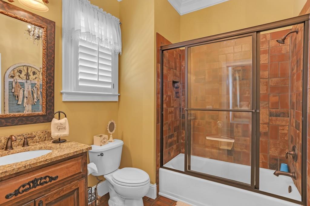 3386 Chandler Road Good Hope, GA 30641 - Photo 31 of 96 a bathroom with a granite countertop sink toilet and shower
