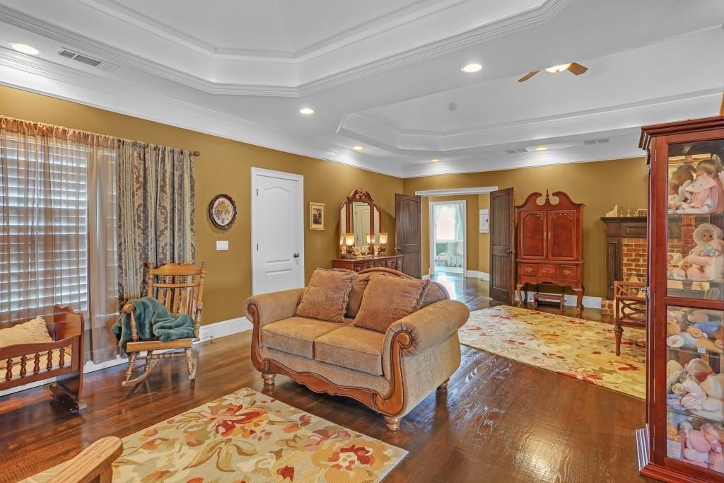 3386 Chandler Road Good Hope, GA 30641 - Photo 41 of 96 a living room with furniture and a rug