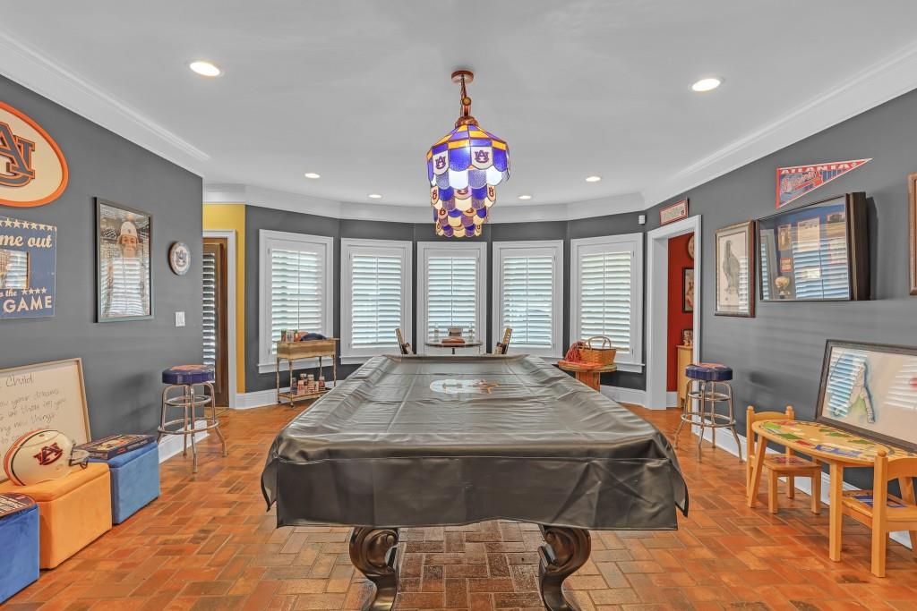 3386 Chandler Road Good Hope, GA 30641 - Photo 52 of 96 a spacious bedroom with a large bed and a chandelier