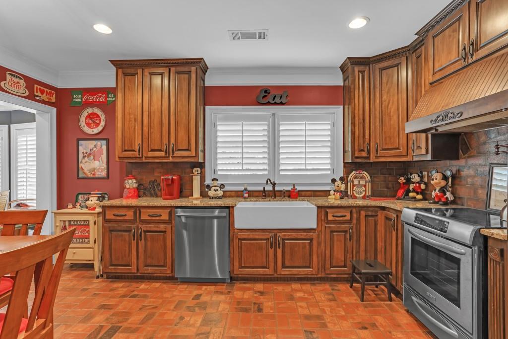 3386 Chandler Road Good Hope, GA 30641 - Photo 57 of 96 a kitchen with stainless steel appliances granite countertop a stove top oven a sink dishwasher and cabinets with wooden floor