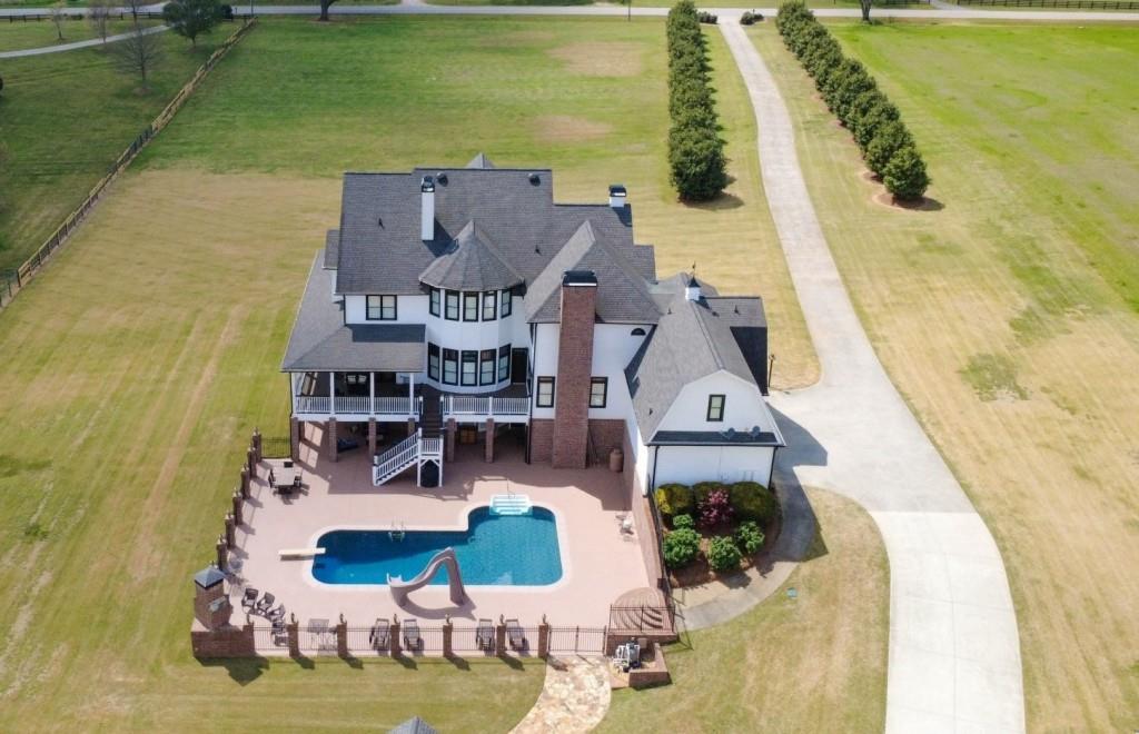 3386 Chandler Road Good Hope, GA 30641 - Photo 6 of 96 an aerial view of a house with outdoor space pool seating area and fire pit