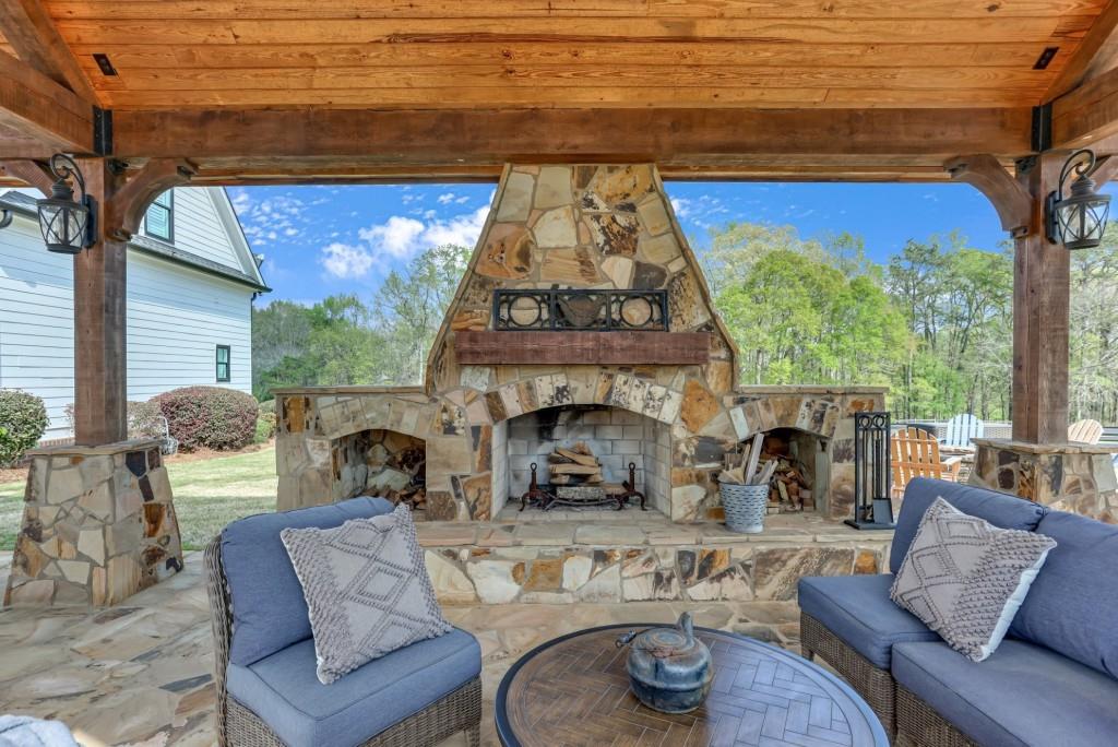 3386 Chandler Road Good Hope, GA 30641 - Photo 75 of 96 a living room with furniture and a fireplace
