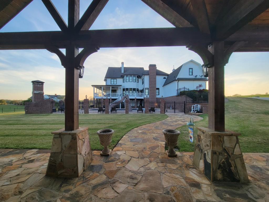 3386 Chandler Road Good Hope, GA 30641 - Photo 77 of 96 a view of a porch with a table chairs and a yard