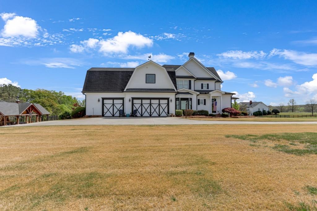 3386 Chandler Road Good Hope, GA 30641 - Photo 83 of 96 a front view of a house with a yard