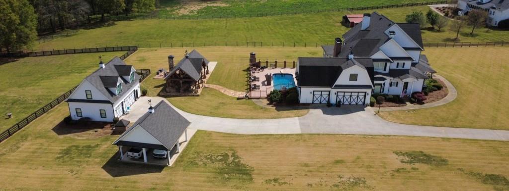 3386 Chandler Road Good Hope, GA 30641 - Photo 85 of 96 an aerial view of a house with swimming pool and ocean view
