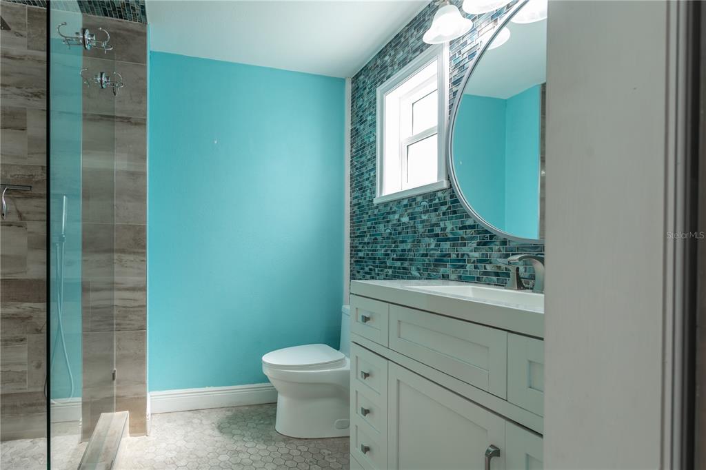 2021 Valley Drive Dunedin, FL 34698 - Photo 24 of 79 a bathroom with a toilet and a sink