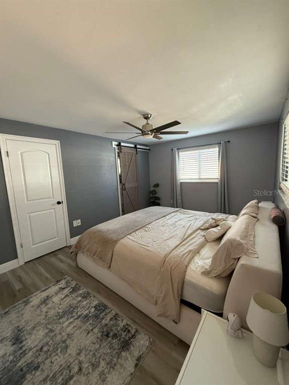 2021 Valley Drive Dunedin, FL 34698 - Photo 30 of 79 a bedroom with a bed and a window