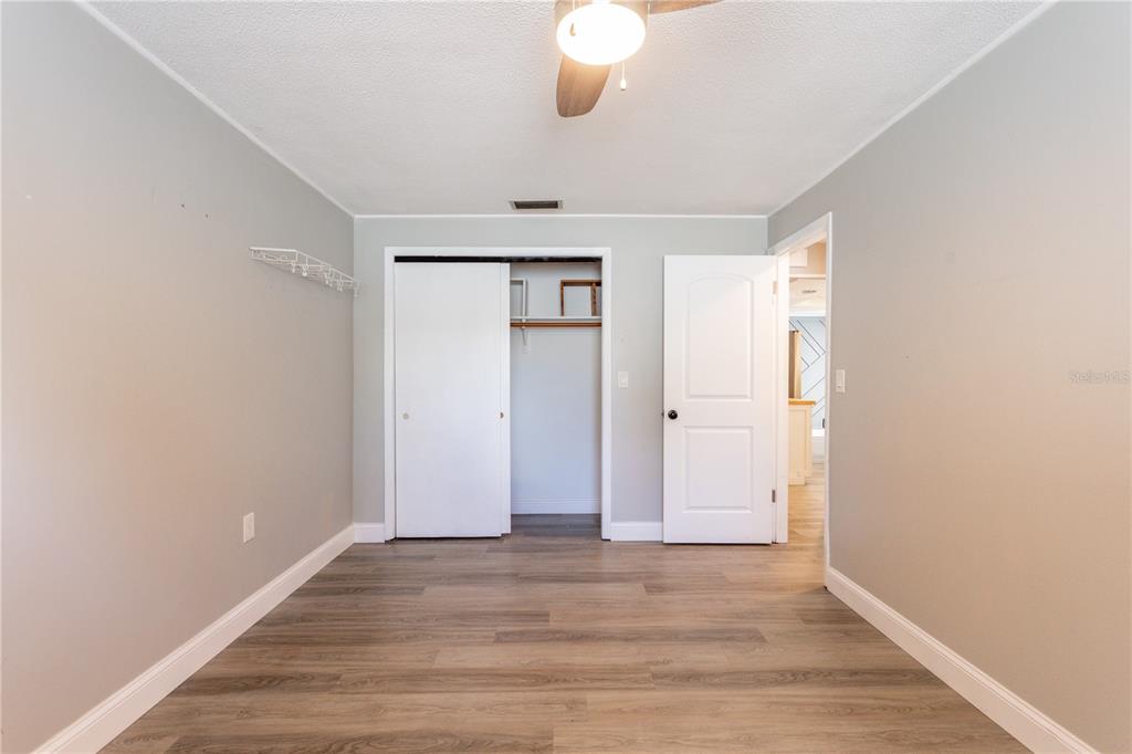 2021 Valley Drive Dunedin, FL 34698 - Photo 41 of 79 wooden floor in an empty room
