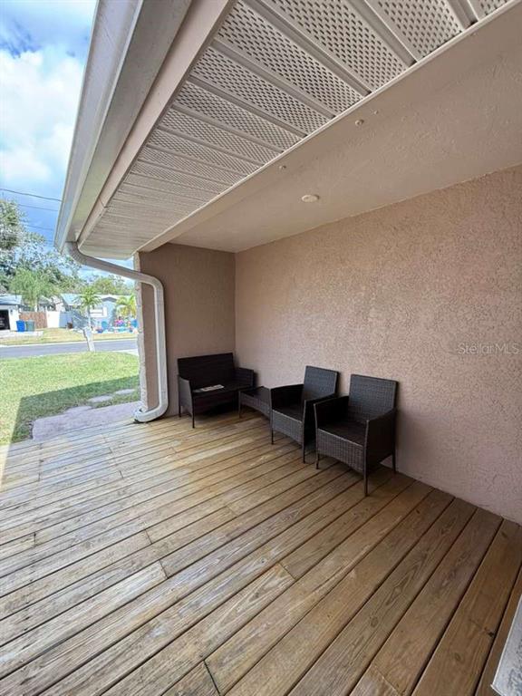 2021 Valley Drive Dunedin, FL 34698 - Photo 47 of 79 a view of a terrace with wooden floor and seating space