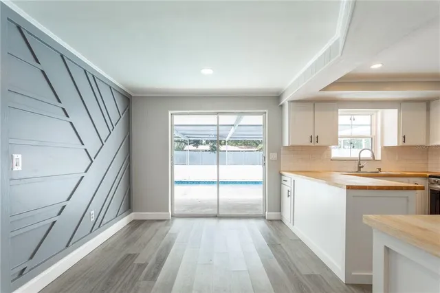 a kitchen with stainless steel appliances granite countertop a stove and a refrigerator