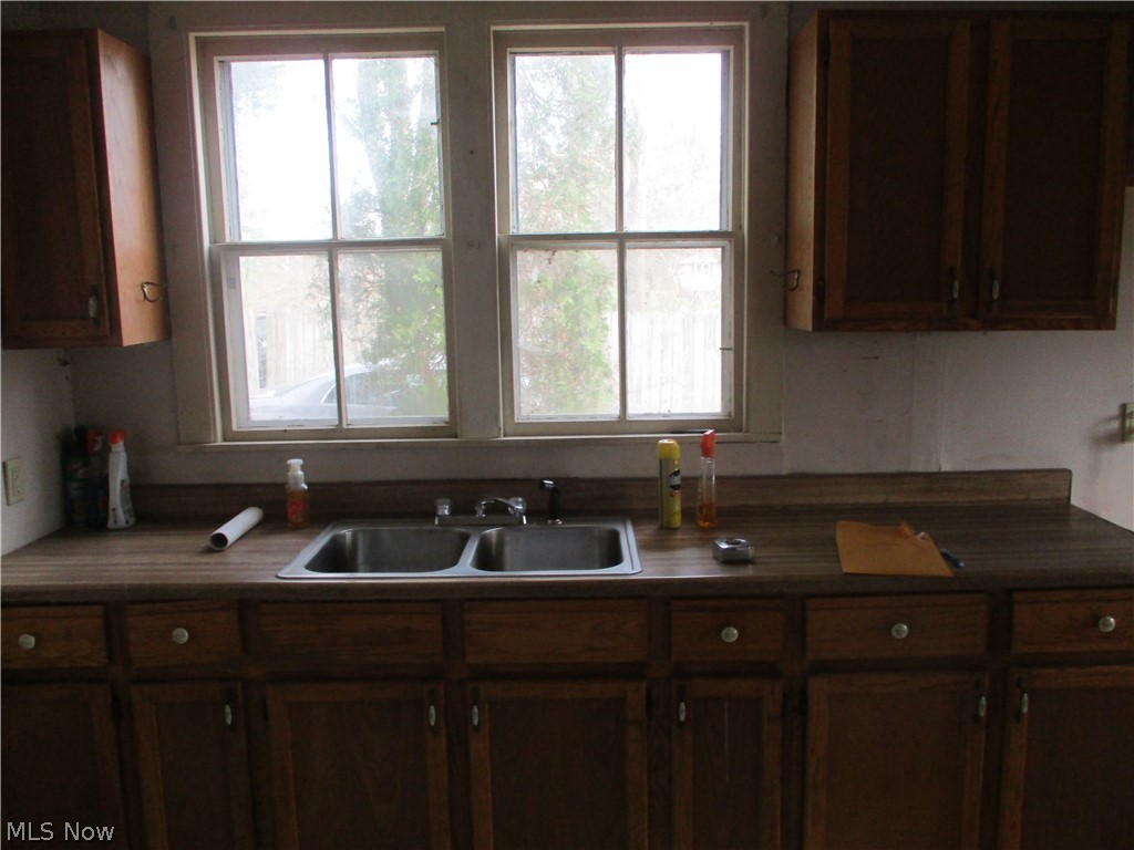 14831 Calaboone Road Doylestown, OH 44230 - Photo 6 of 14 Kitchen featuring a sink and dark wood finish cabinets