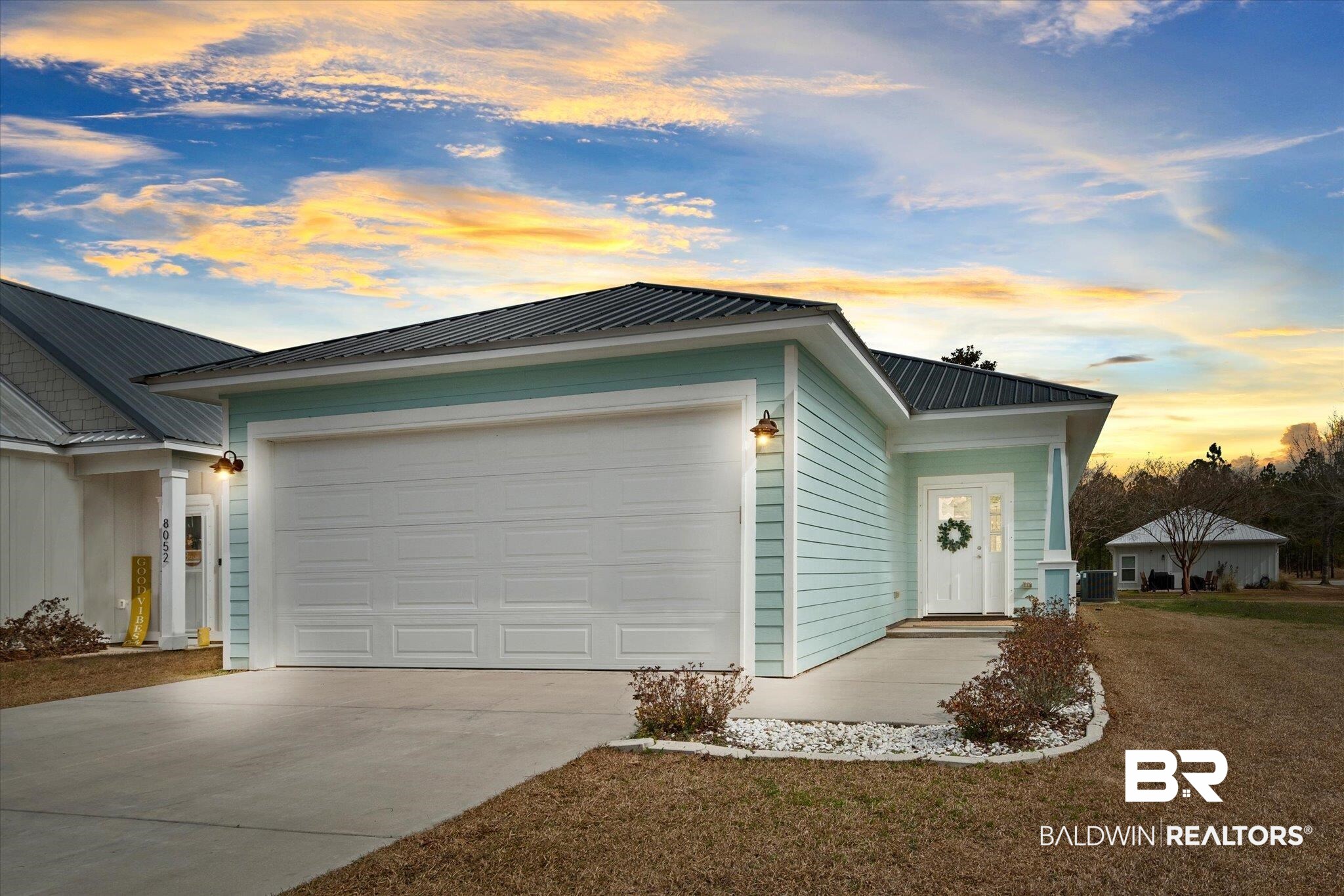 8056 Carmel Circle Foley, AL 36535 - Photo 1 of 28 View of front of property featuring a garage and a lawn