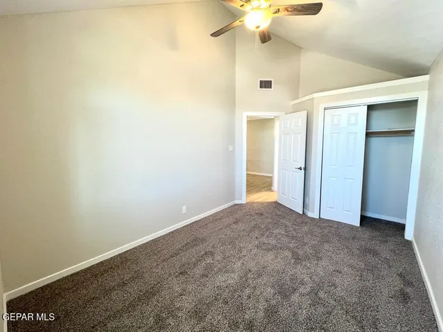 an empty room with a bathroom