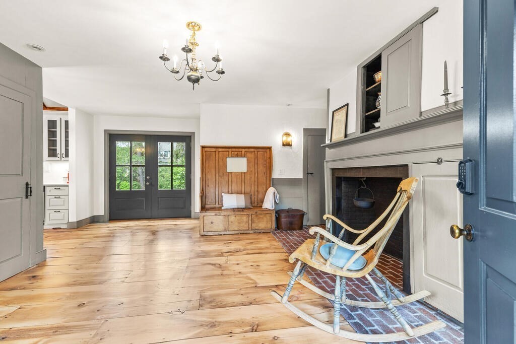 85 Raymond Road Sudbury, MA 01776 - Photo 7 of 42 a view of a livingroom with furniture and a fireplace
