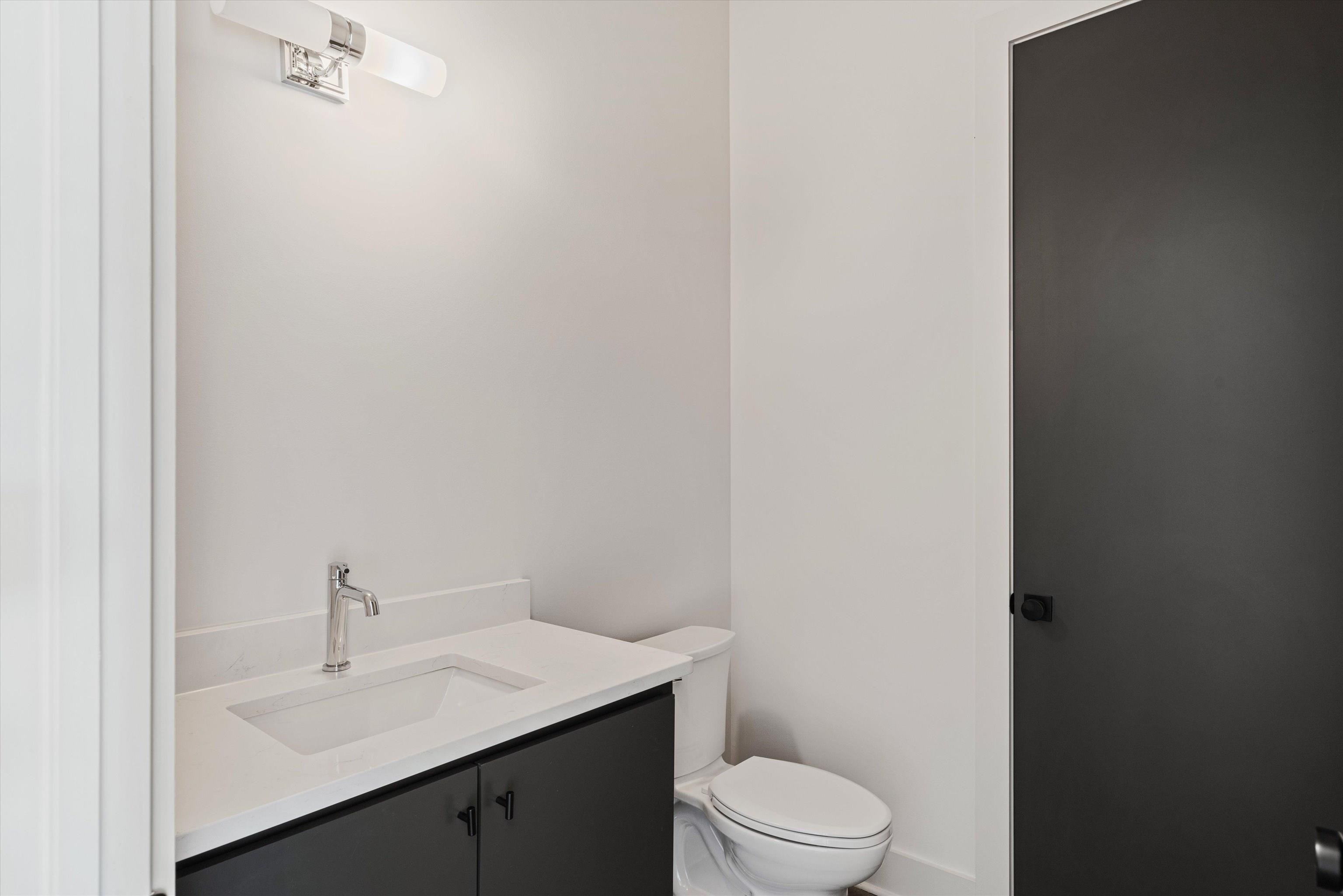 760 Meda Street Memphis, TN 38104 - Photo 14 of 16 a bathroom with a sink toilet and vanity