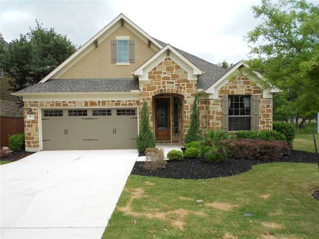 4102 Remington Road Cedar Park, TX 78613 - Photo 1 of 1 a front view of a house with a yard and garage