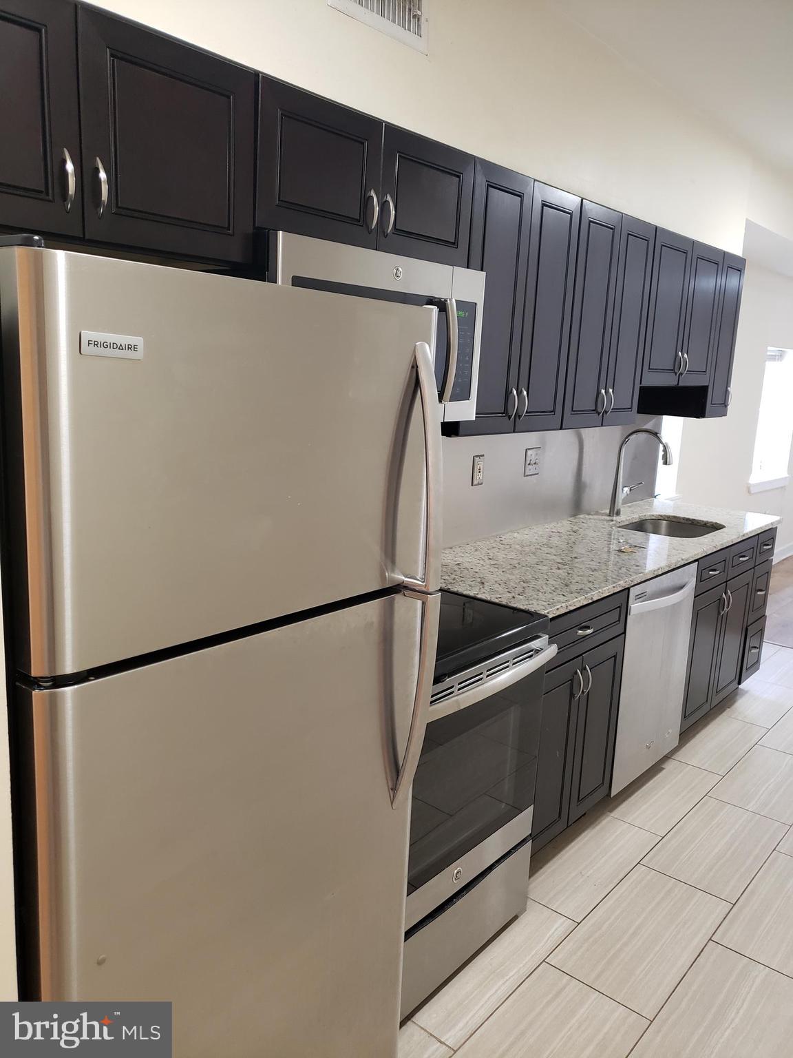 319 Market Street, Unit 3 Philadelphia, PA 19106 - Photo 1 of 14 a kitchen with stainless steel appliances a refrigerator sink and cabinets