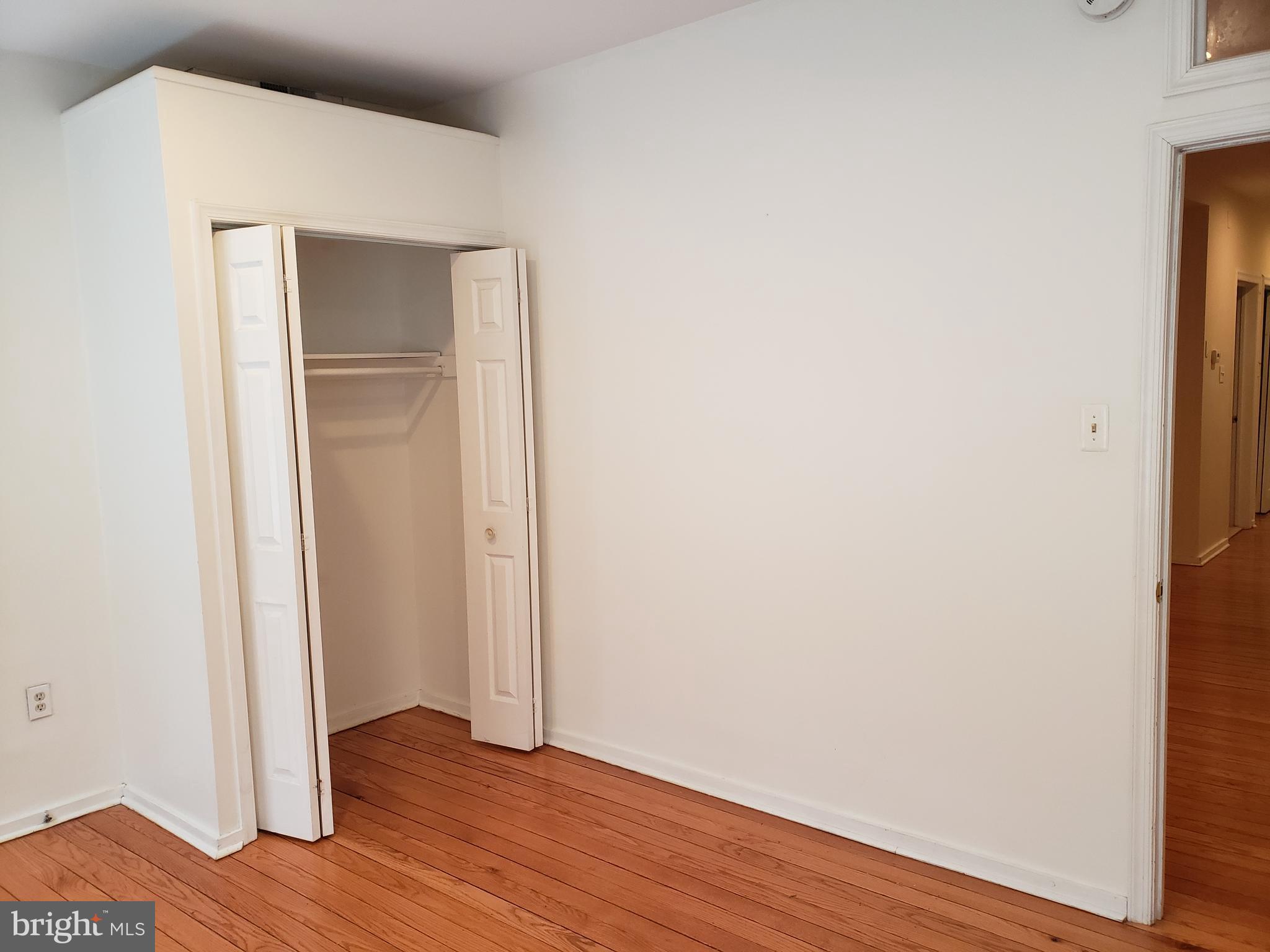 319 Market Street, Unit 3 Philadelphia, PA 19106 - Photo 4 of 14 a view of an empty room with wooden floor and closet