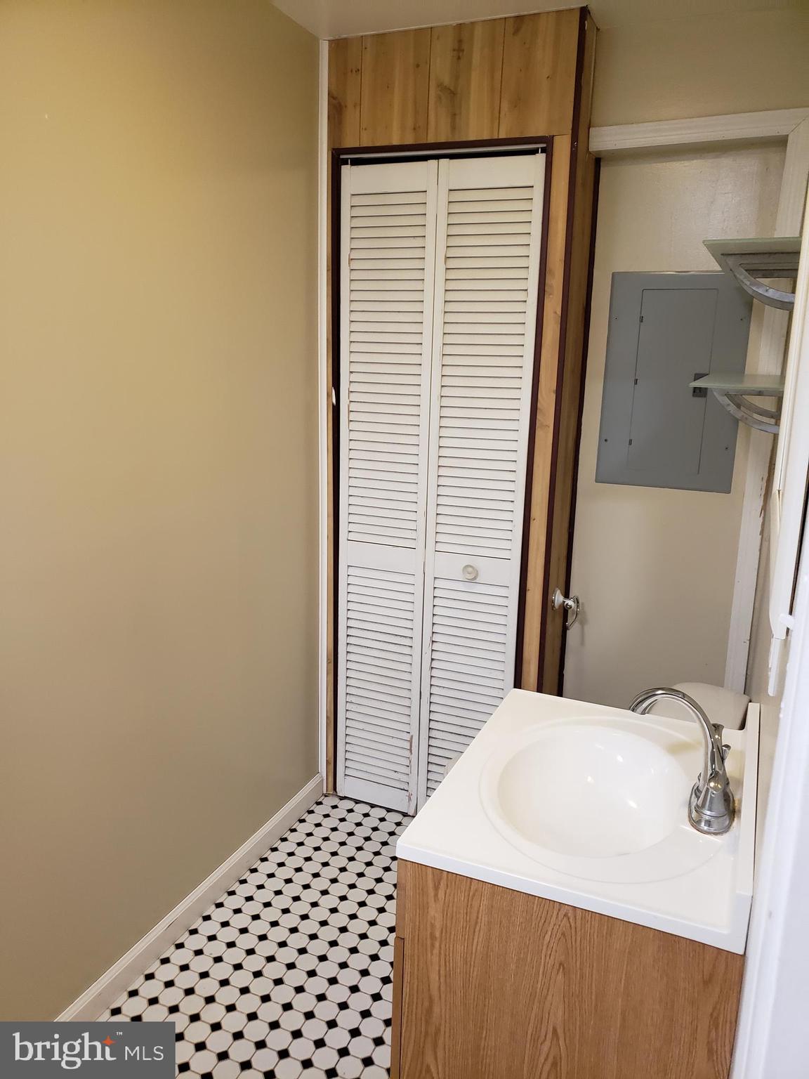 319 Market Street, Unit 3 Philadelphia, PA 19106 - Photo 9 of 14 a bathroom with a sink and a mirror