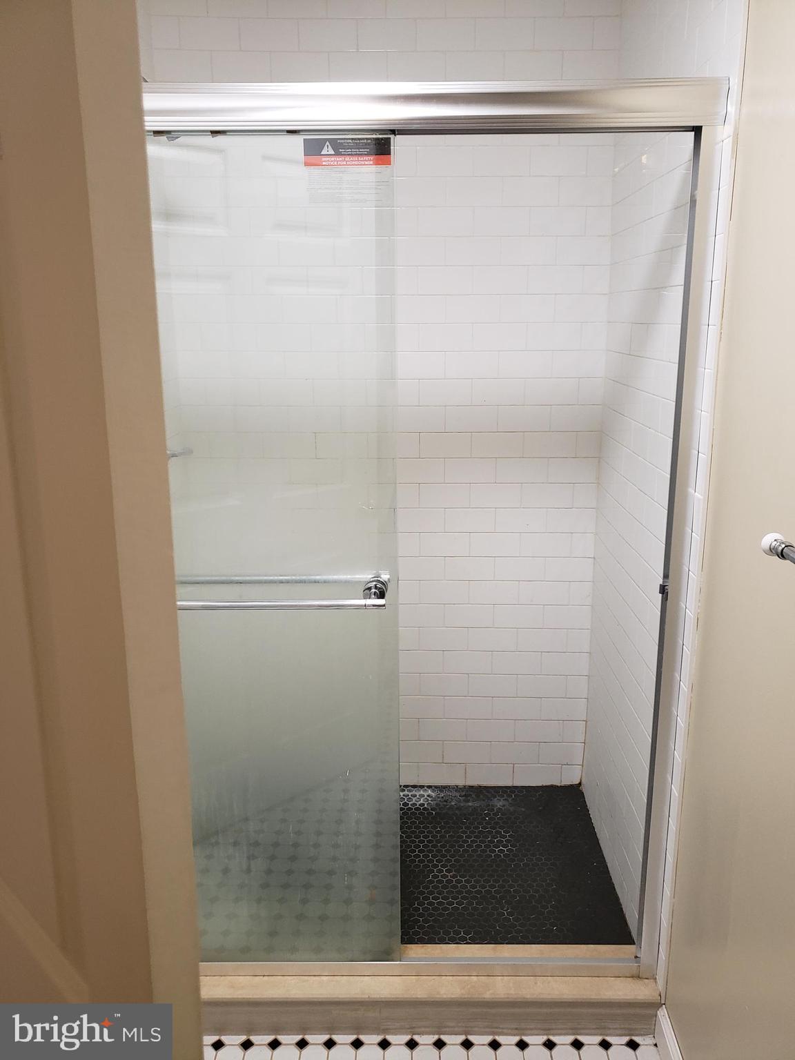 319 Market Street, Unit 3 Philadelphia, PA 19106 - Photo 10 of 14 a bathroom with a glass shower door