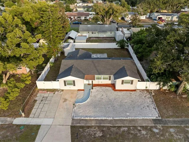 a view of large kitchen with wooden floor and windows