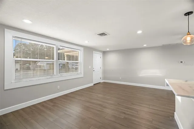 a view of kitchen with wooden floor