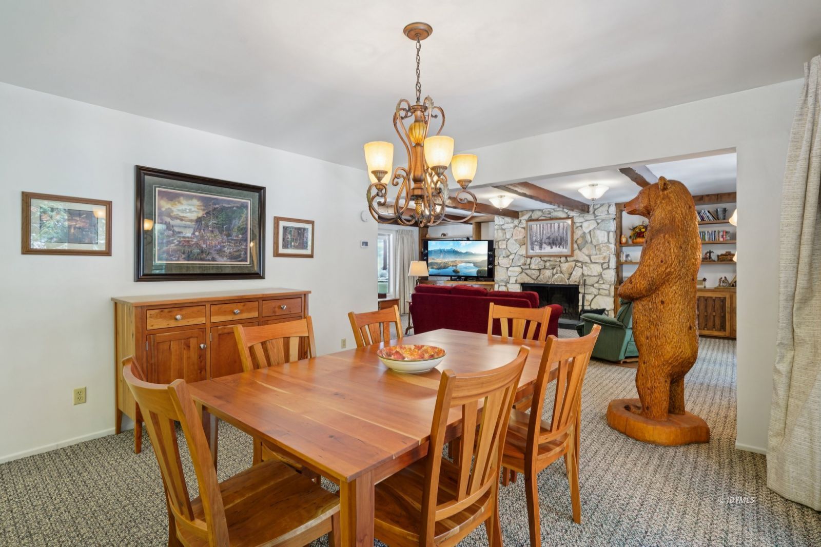 24490 Upper Rim Rock Road Idyllwild, CA 92549 - Photo 15 of 41 a dining room with furniture a chandelier and window
