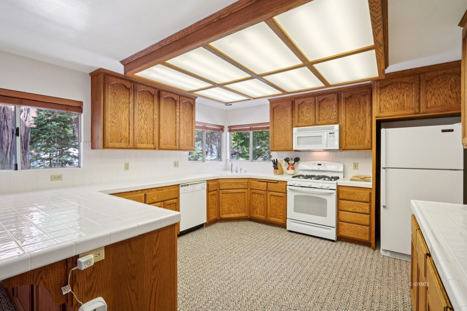 24490 Upper Rim Rock Road Idyllwild, CA 92549 - Photo 17 of 41 a kitchen with stainless steel appliances granite countertop a sink stove and refrigerator