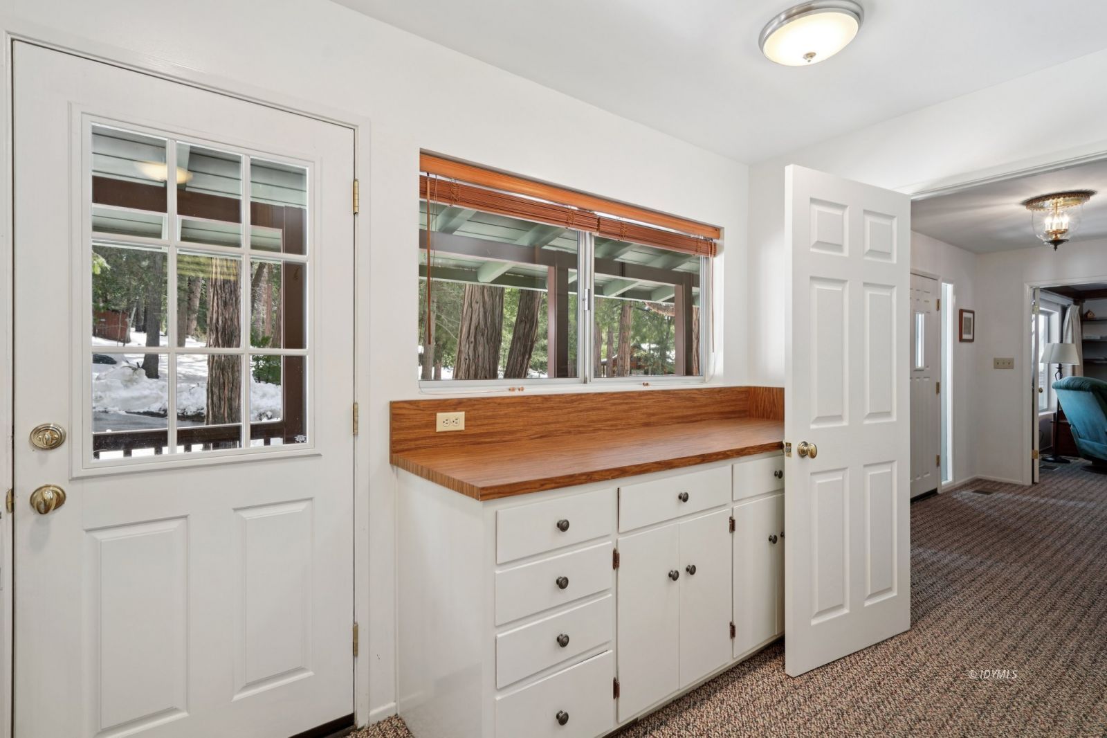 24490 Upper Rim Rock Road Idyllwild, CA 92549 - Photo 20 of 41 view of kitchen with granite countertop cabinets and window
