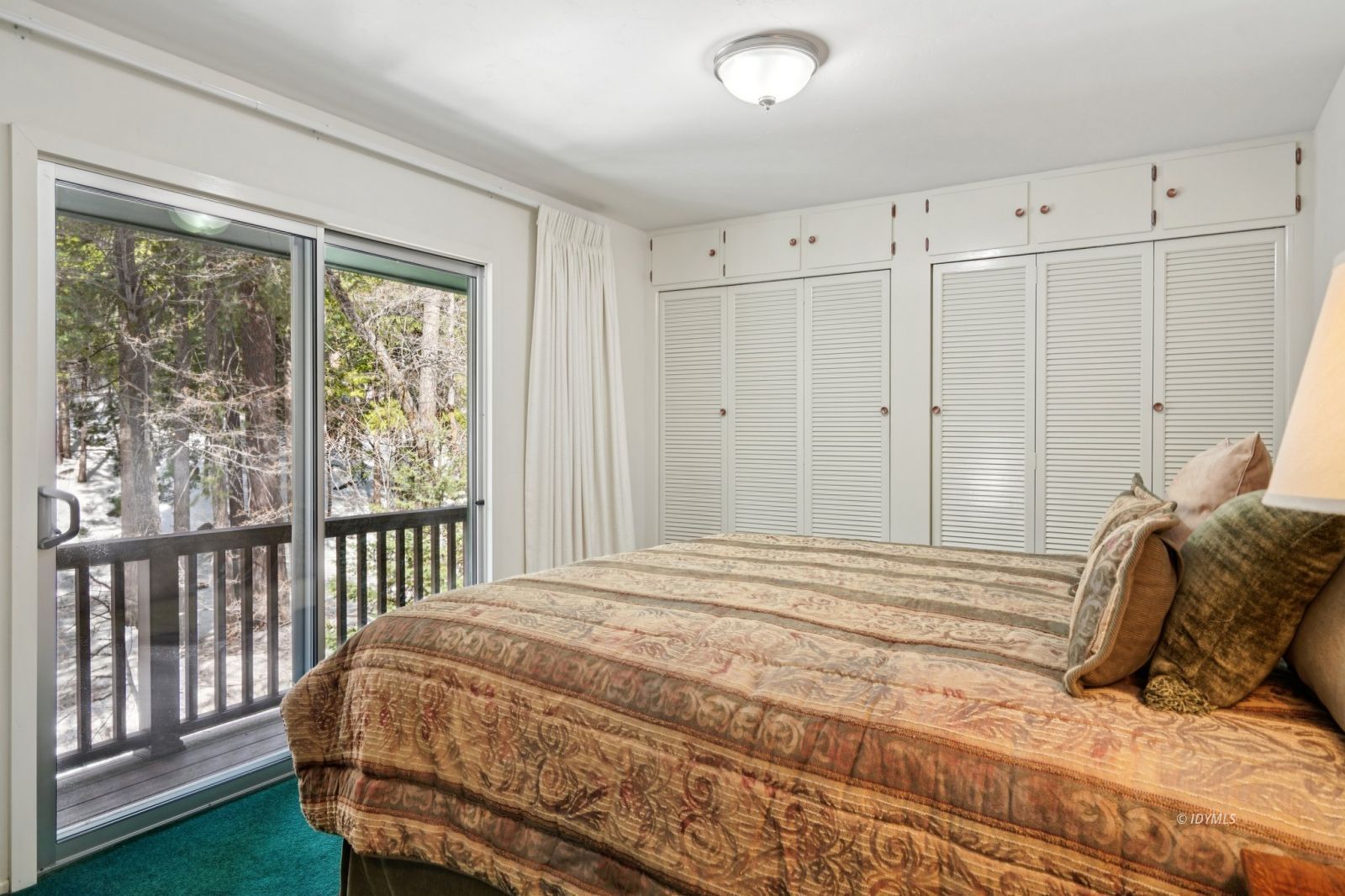 24490 Upper Rim Rock Road Idyllwild, CA 92549 - Photo 2 of 41 a bedroom with a bed and a window