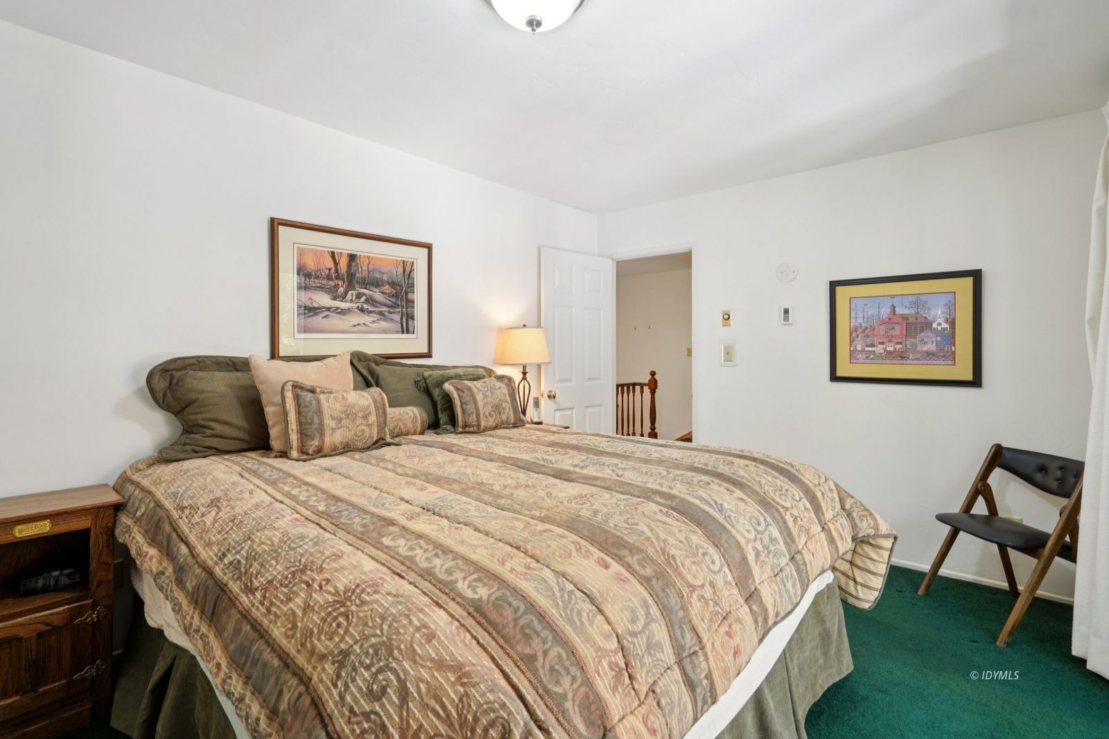 24490 Upper Rim Rock Road Idyllwild, CA 92549 - Photo 28 of 41 a bed room with a bed and a chair