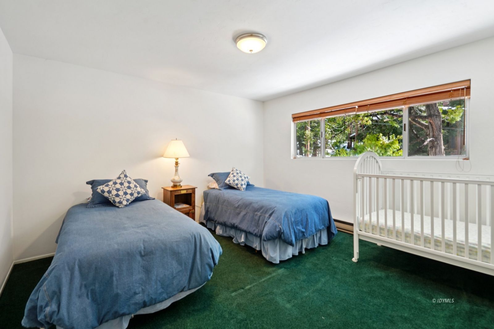 24490 Upper Rim Rock Road Idyllwild, CA 92549 - Photo 31 of 41 a bedroom with two beds and a large window