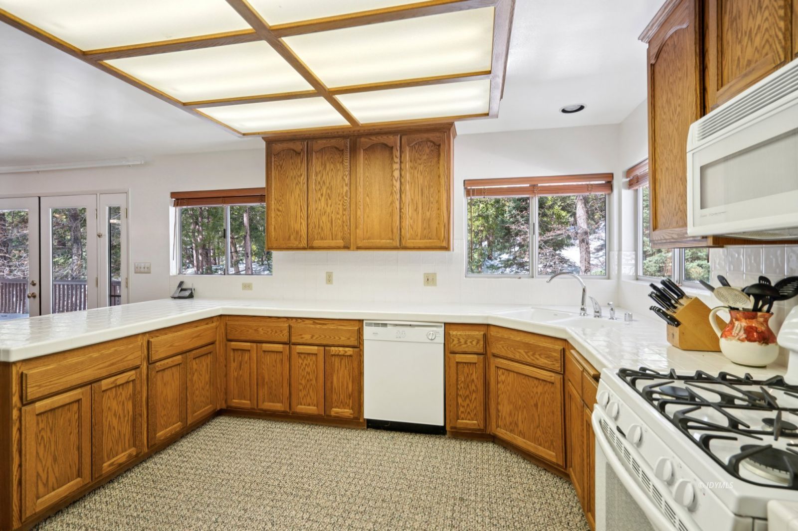 24490 Upper Rim Rock Road Idyllwild, CA 92549 - Photo 5 of 41 a kitchen with stainless steel appliances a stove sink and cabinets