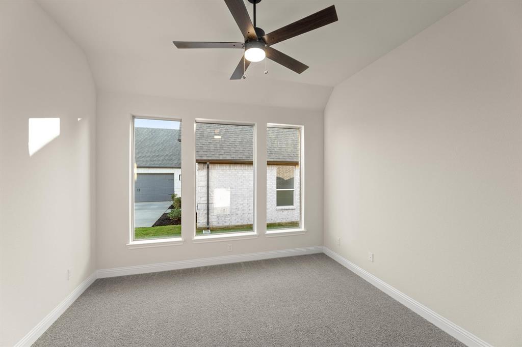 51 Magpie Street Joshua, TX 76058 - Photo 16 of 29 an empty room with windows and fan