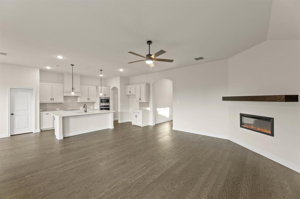 51 Magpie Street Joshua, TX 76058 - Photo 7 of 29 a view of kitchen with refrigerator and white cabinets