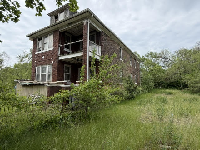 304 Polk Street Gary, IN 46402 - Photo 3 of 26 a front view of a house with a yard