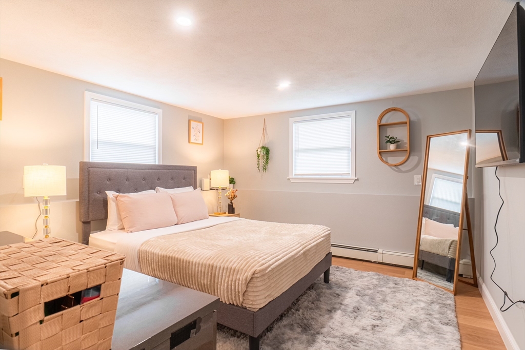 33 Bristow Street, Unit 2 Saugus, MA 01906 - Photo 14 of 21 a bedroom with a bed and a window